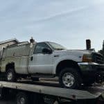 2009 Ford Pickup with a Utility Bed on the flatbed from Rochester.