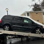 Greece, NY, to collect a 2009 Dodge Caravan owned by Dom and Ivana