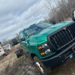 Front view of a green Truck picked up in Hilton